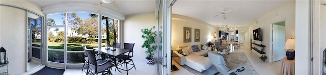 interior space with light tile flooring and vaulted ceiling