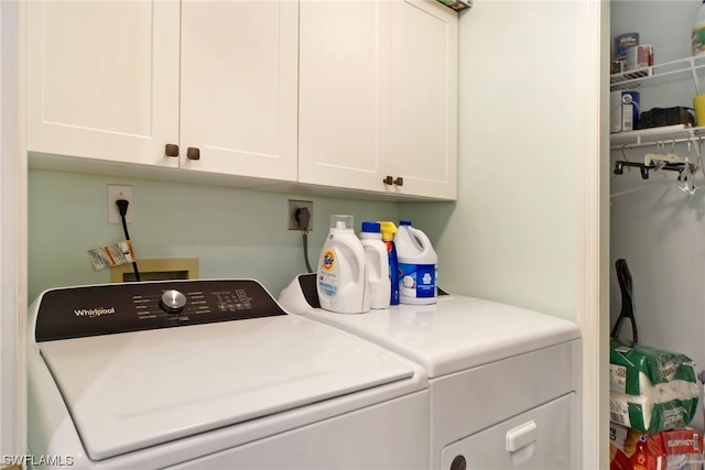 laundry area with washer hookup, cabinets, hookup for an electric dryer, and washing machine and clothes dryer