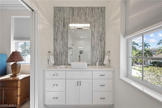 bathroom with a shower and vanity