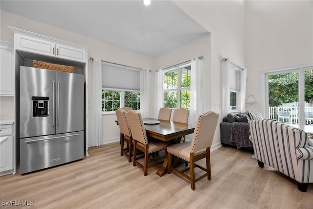 dining area featuring light wood-type flooring