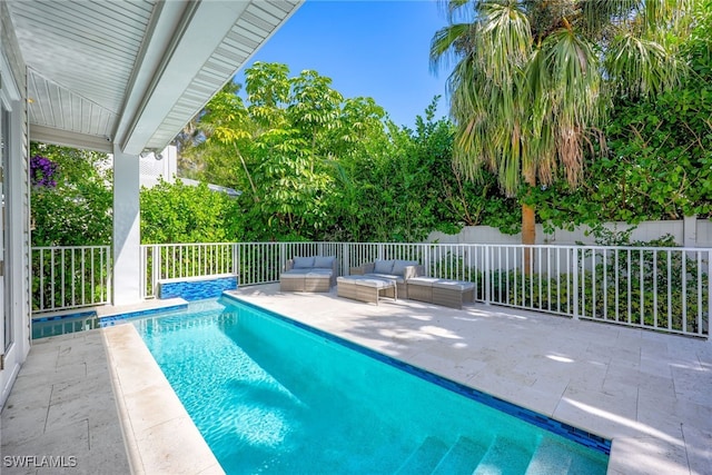 view of pool featuring a patio area and outdoor lounge area