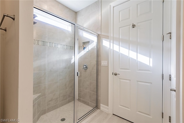 bathroom featuring an enclosed shower