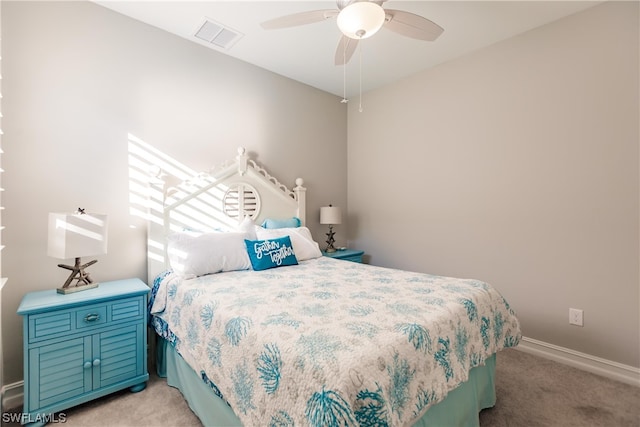 bedroom with ceiling fan and light carpet