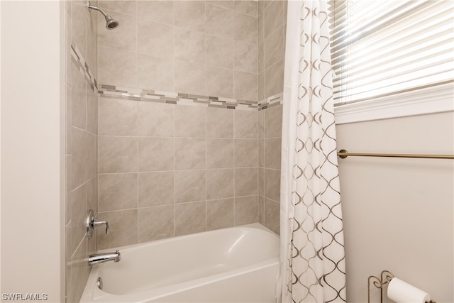 bathroom with shower / bathtub combination with curtain