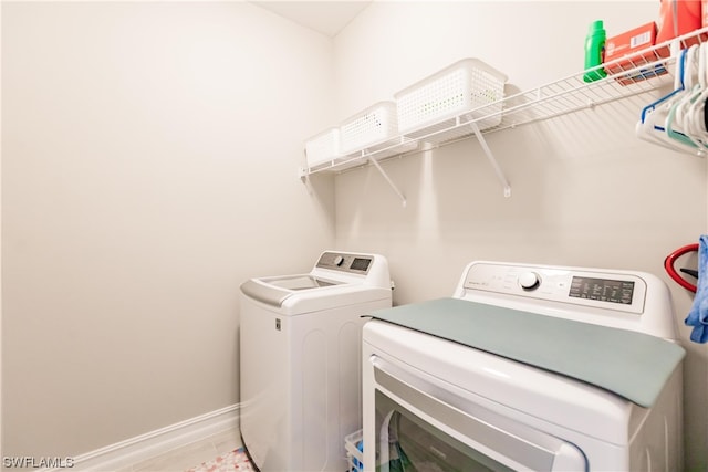 laundry room featuring washing machine and dryer