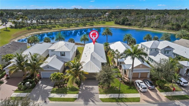 birds eye view of property with a water view