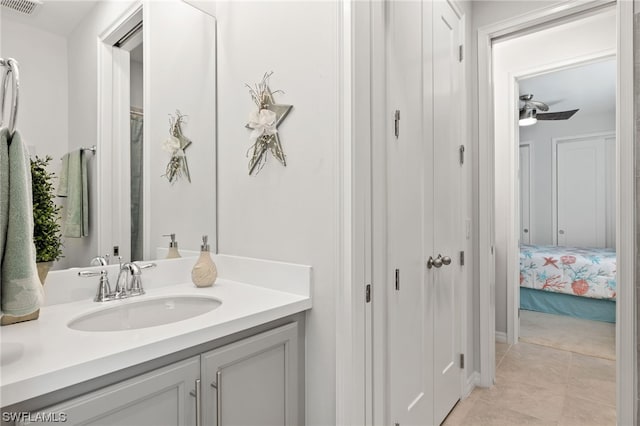 bathroom with tile patterned flooring and vanity