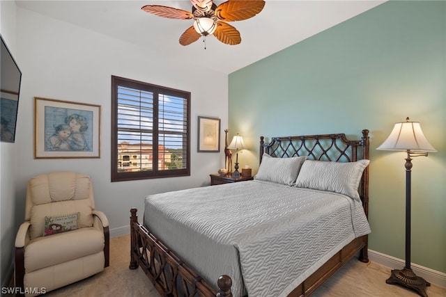 bedroom with light carpet and ceiling fan