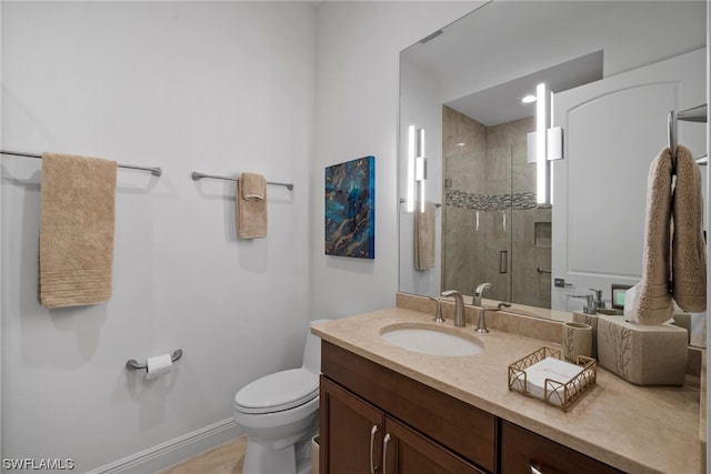 bathroom with oversized vanity, toilet, and a shower with door