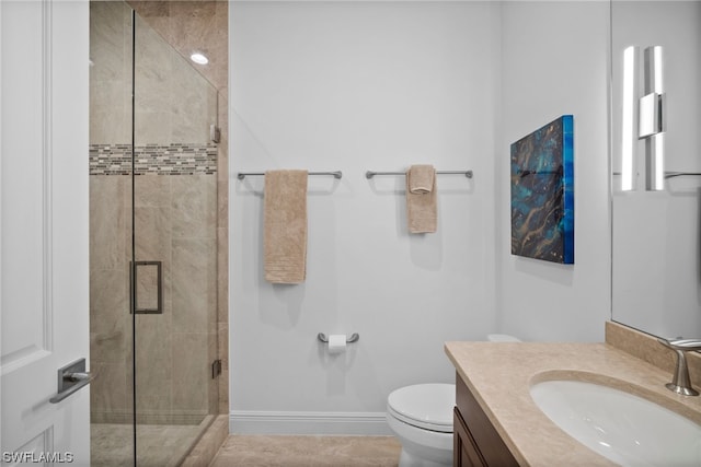 bathroom featuring toilet, walk in shower, and vanity