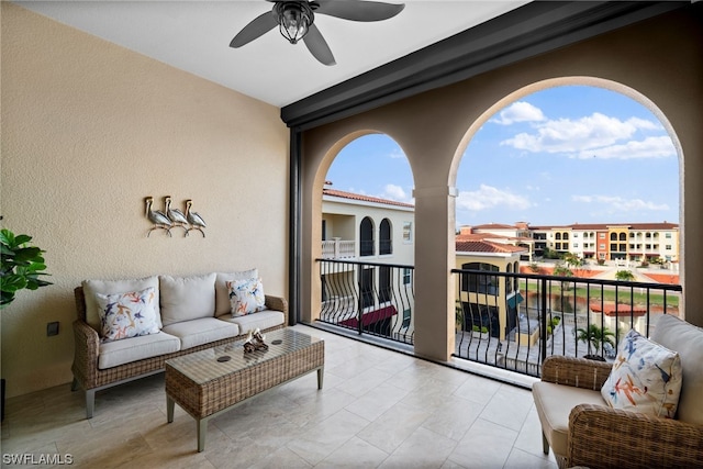 tiled living room with ceiling fan and a wealth of natural light