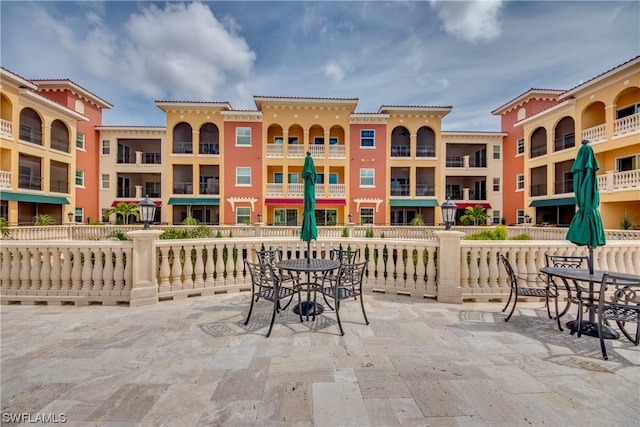 view of patio featuring a balcony