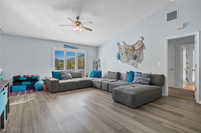 living room with ceiling fan and hardwood / wood-style flooring