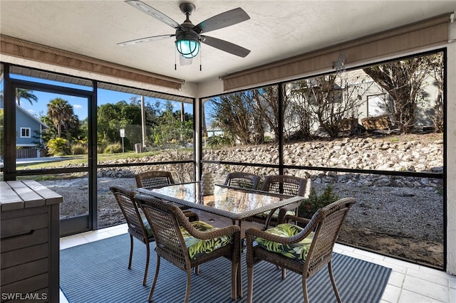 sunroom / solarium with ceiling fan