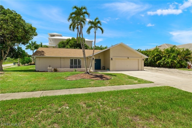 ranch-style house featuring a garage and a front lawn