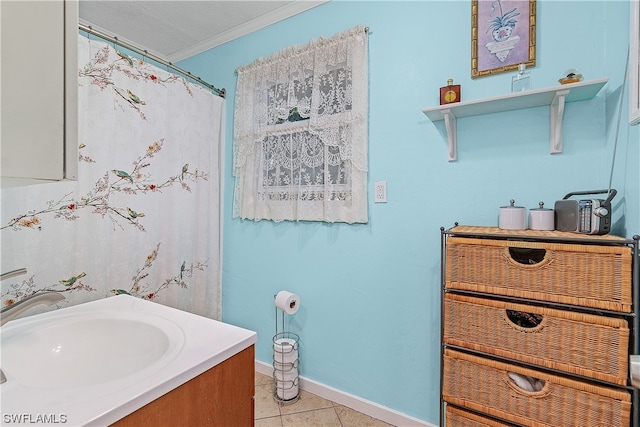 bathroom featuring tile patterned floors, vanity, and ornamental molding