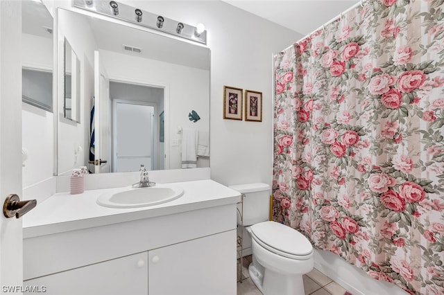 full bathroom featuring vanity, tile flooring, shower / bath combo with shower curtain, and toilet