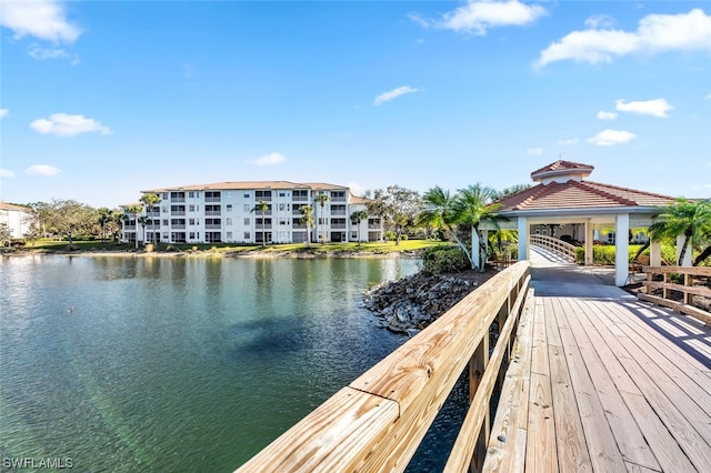 view of dock featuring a gazebo and a water view