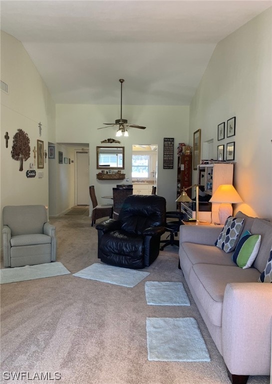 carpeted living room featuring lofted ceiling and ceiling fan