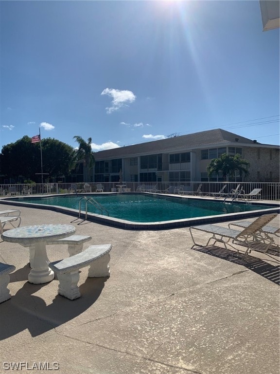 view of swimming pool with a patio