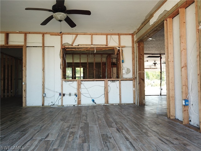 spare room with ceiling fan and dark wood-type flooring