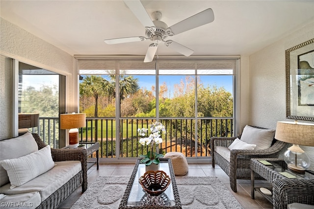 sunroom / solarium featuring ceiling fan and a wealth of natural light