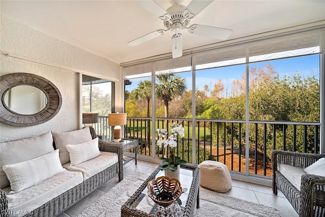 sunroom / solarium featuring ceiling fan