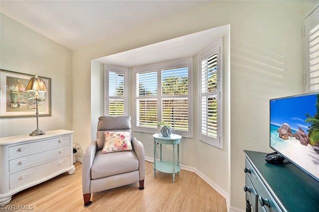 sitting room with light hardwood / wood-style flooring