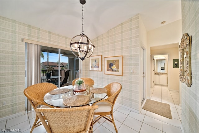 tiled dining room featuring lofted ceiling and a notable chandelier