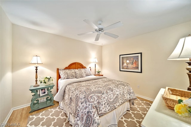 bedroom featuring ceiling fan and light wood-type flooring