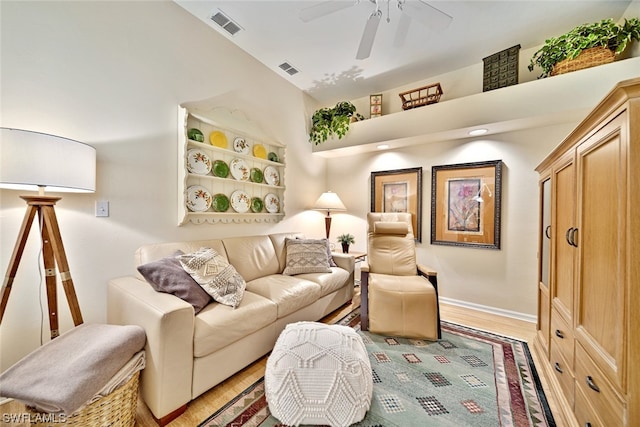 interior space with ceiling fan and light hardwood / wood-style flooring