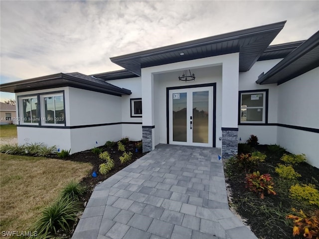 view of exterior entry featuring french doors