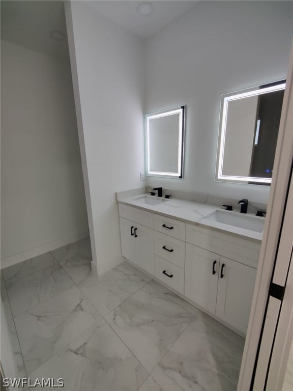 bathroom featuring tile floors and dual vanity