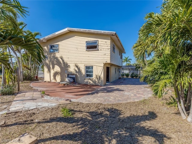 rear view of house featuring a patio