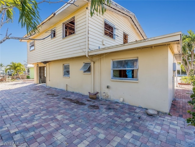 rear view of house featuring a patio