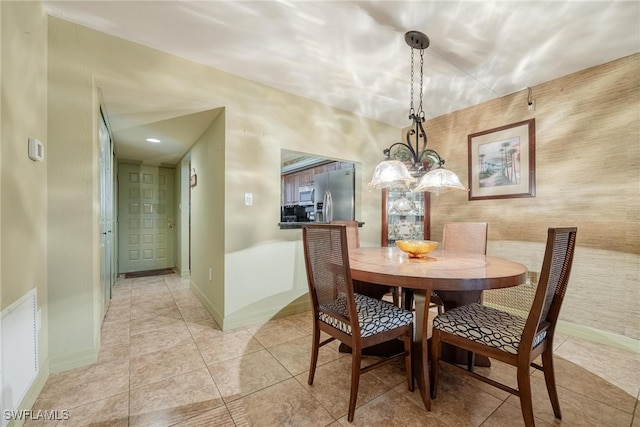 dining area featuring light tile patterned floors