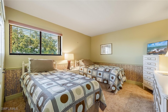 bedroom featuring light tile patterned flooring