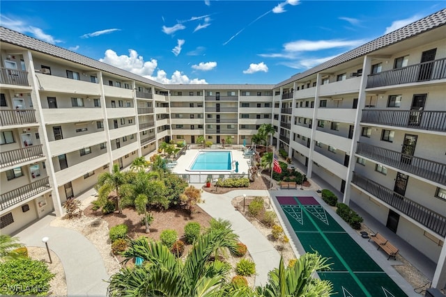 view of building exterior with a community pool