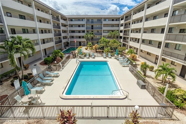 view of swimming pool featuring a patio area