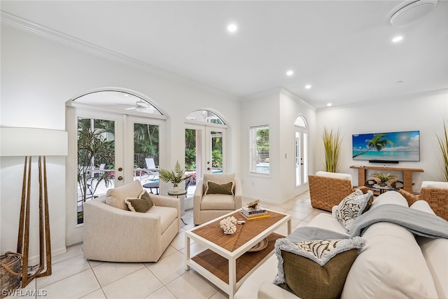 living room featuring ornamental molding, light tile floors, and french doors