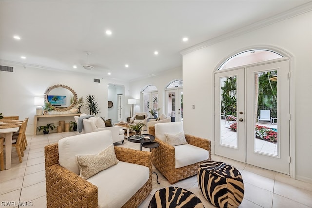 living room featuring crown molding, french doors, a wealth of natural light, and light tile flooring