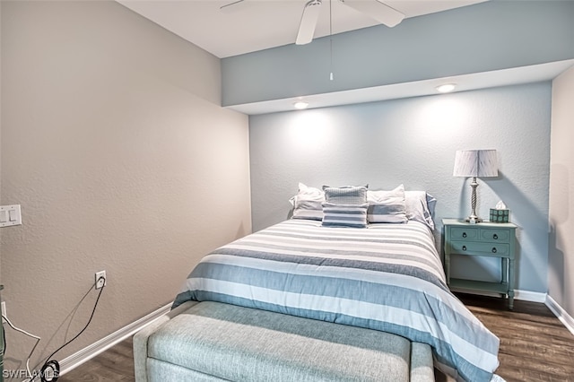 bedroom with ceiling fan and dark wood-type flooring