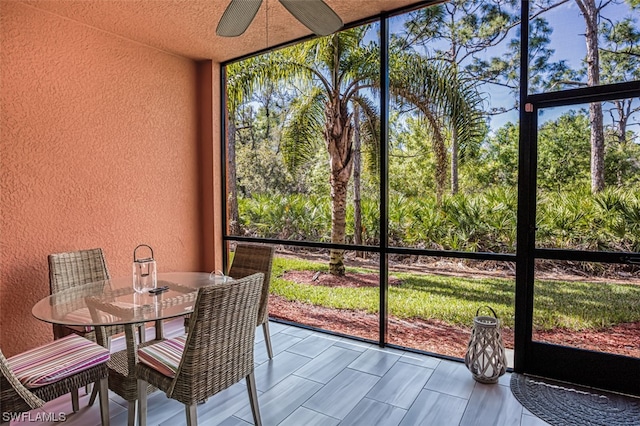 sunroom / solarium with ceiling fan