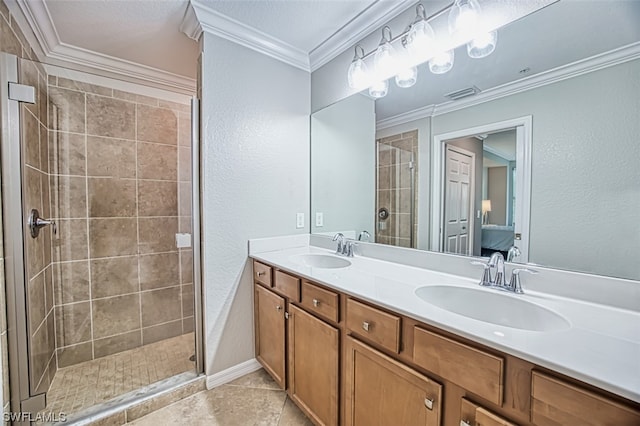 bathroom featuring a tile shower, tile flooring, a textured ceiling, crown molding, and dual bowl vanity