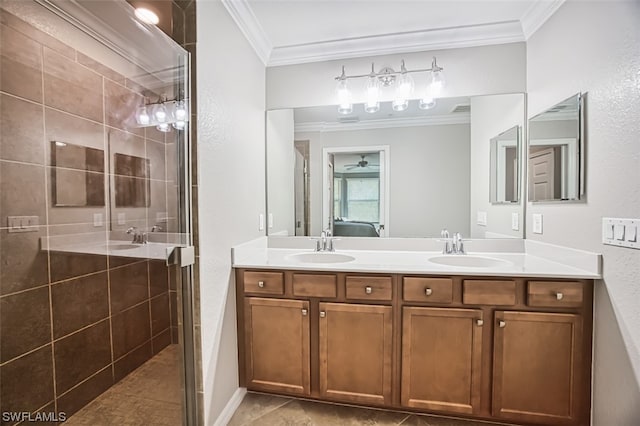 bathroom with double sink vanity, ornamental molding, tile floors, and ceiling fan