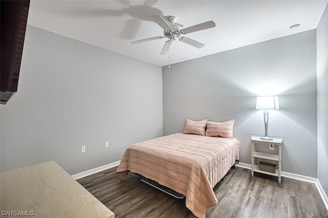 bedroom featuring ceiling fan and dark wood-type flooring