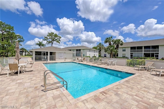 view of swimming pool featuring a patio area