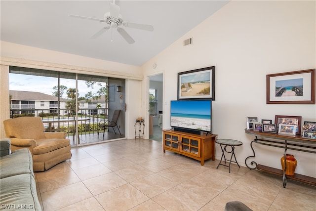 tiled living room featuring high vaulted ceiling and ceiling fan