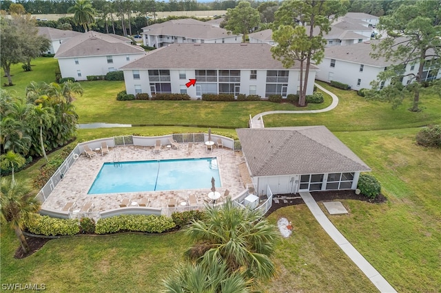 view of pool featuring a yard