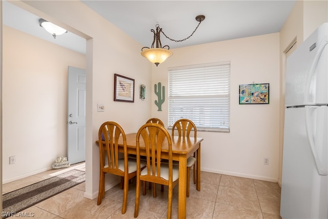 view of tiled dining space